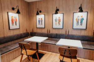 Break out area with feature artwork from Mashka's Marvellous Menagerie. Timber break walls and bespoke leather banquette seating.