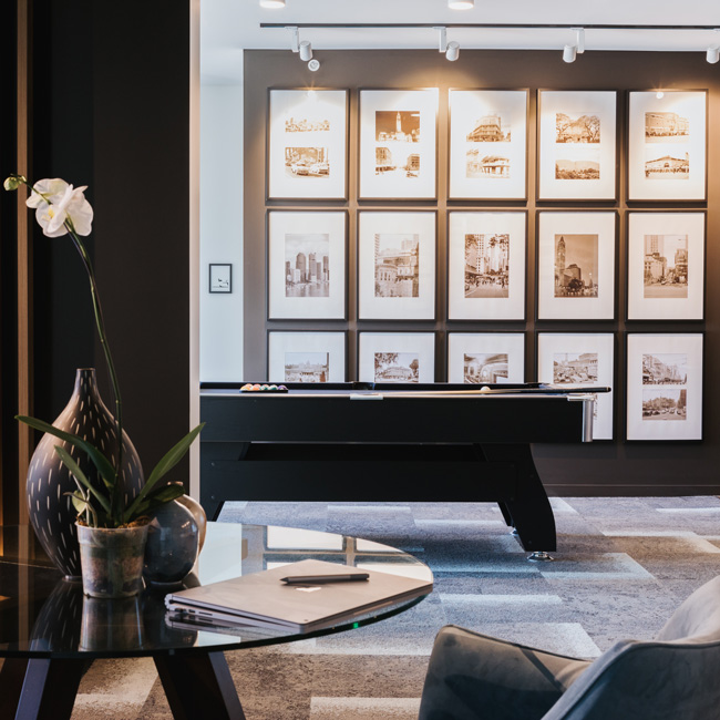 Living room vase décor on study table. Pool room with full artwork wall.